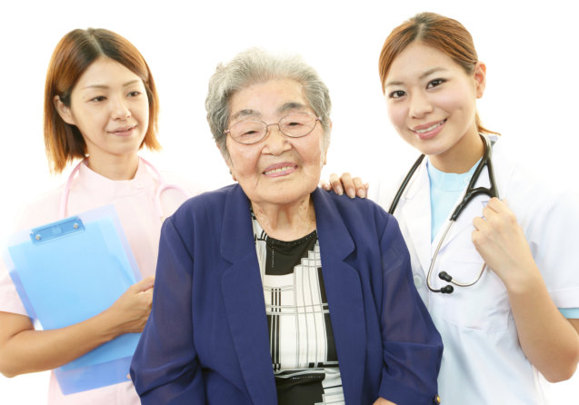 elderly patient and two medical staff