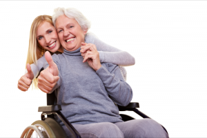 elderly woman and her caregiver showing their thumbs up